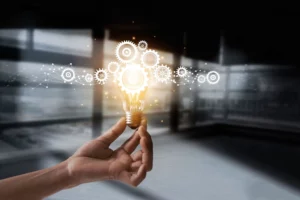 a hand holding a lightbulb