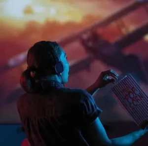 girl at movie theater with popcorn