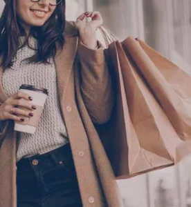 woman with shopping bag and coffee